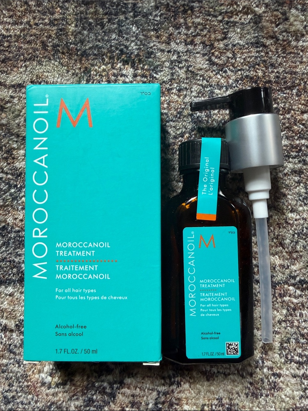 Moroccanoil Treatment Bottle with Teal Label and Amber Glass